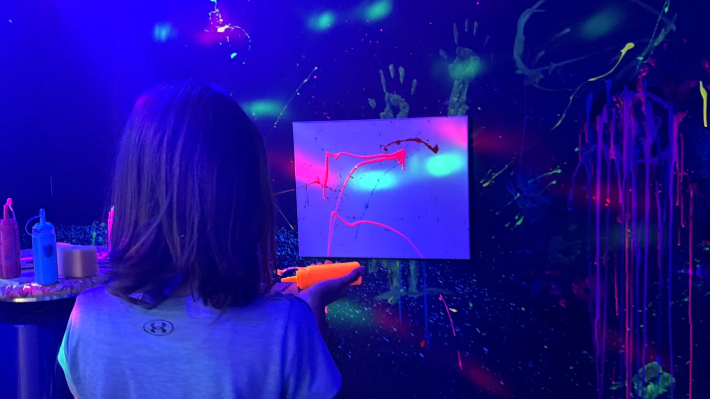 Guest creating art in the glow room